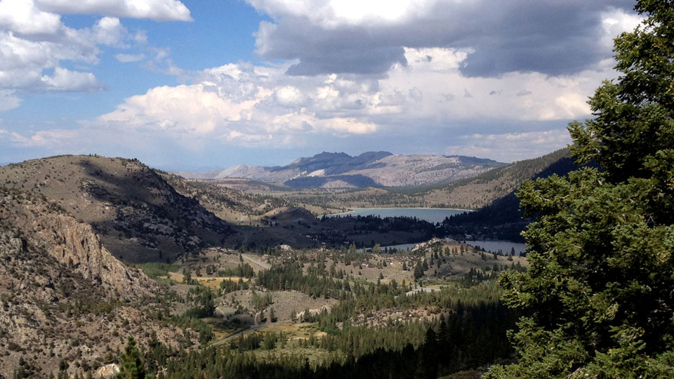 A view of mountain lakes and passing clouds